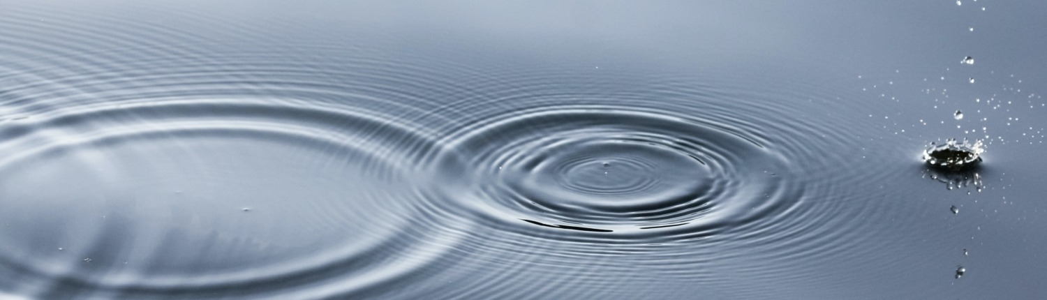 Water with ripple caused by dripping water.